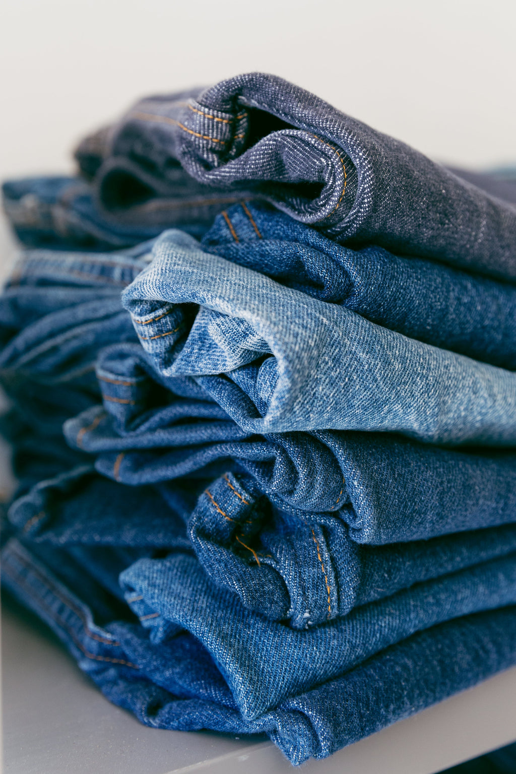 pile of jeans at sleekdenim.com 