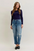 Judy Blue Mid Rise Boyfriend Patch & Repair Destroy Release Hem Jeans 881045 - Sleekdenim.com