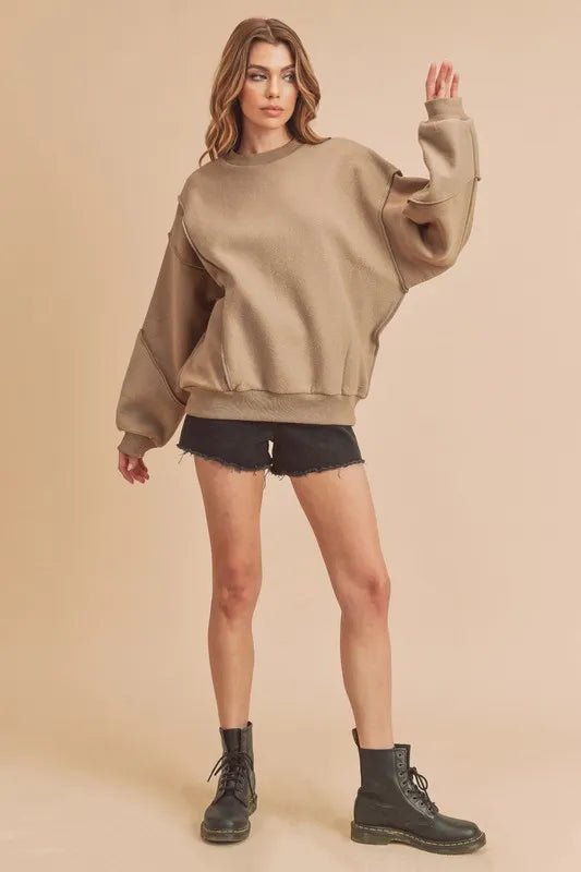 Aemi + Co Exposed Seam Round Neck Drop Shoulder Sweatshirt - Sleekdenim.com